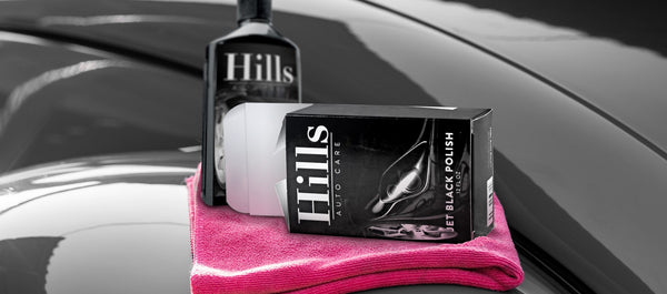 Custom printed auto care product box inside a vehicle