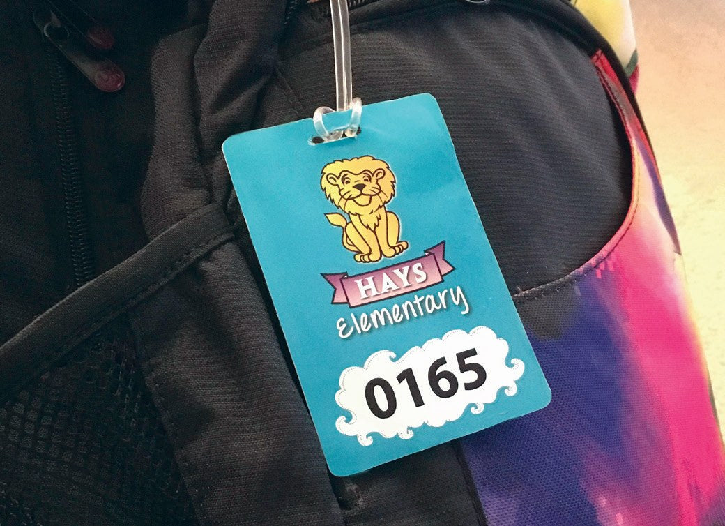 Custom student identification tag attached to a backpack