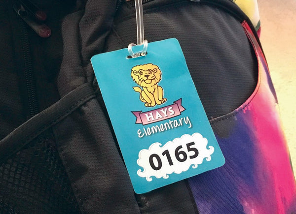 Custom student identification tag attached to a backpack